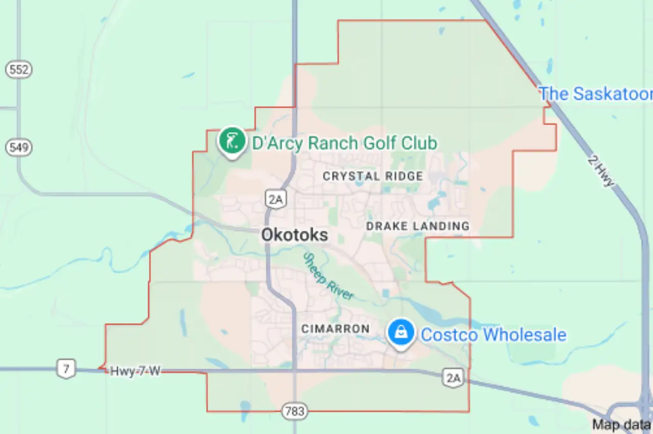 A map of Okotoks, showing the locations of D'Arcy Ranch Golf Club and Costco Wholesale, with neighborhoods and main roads labeled.